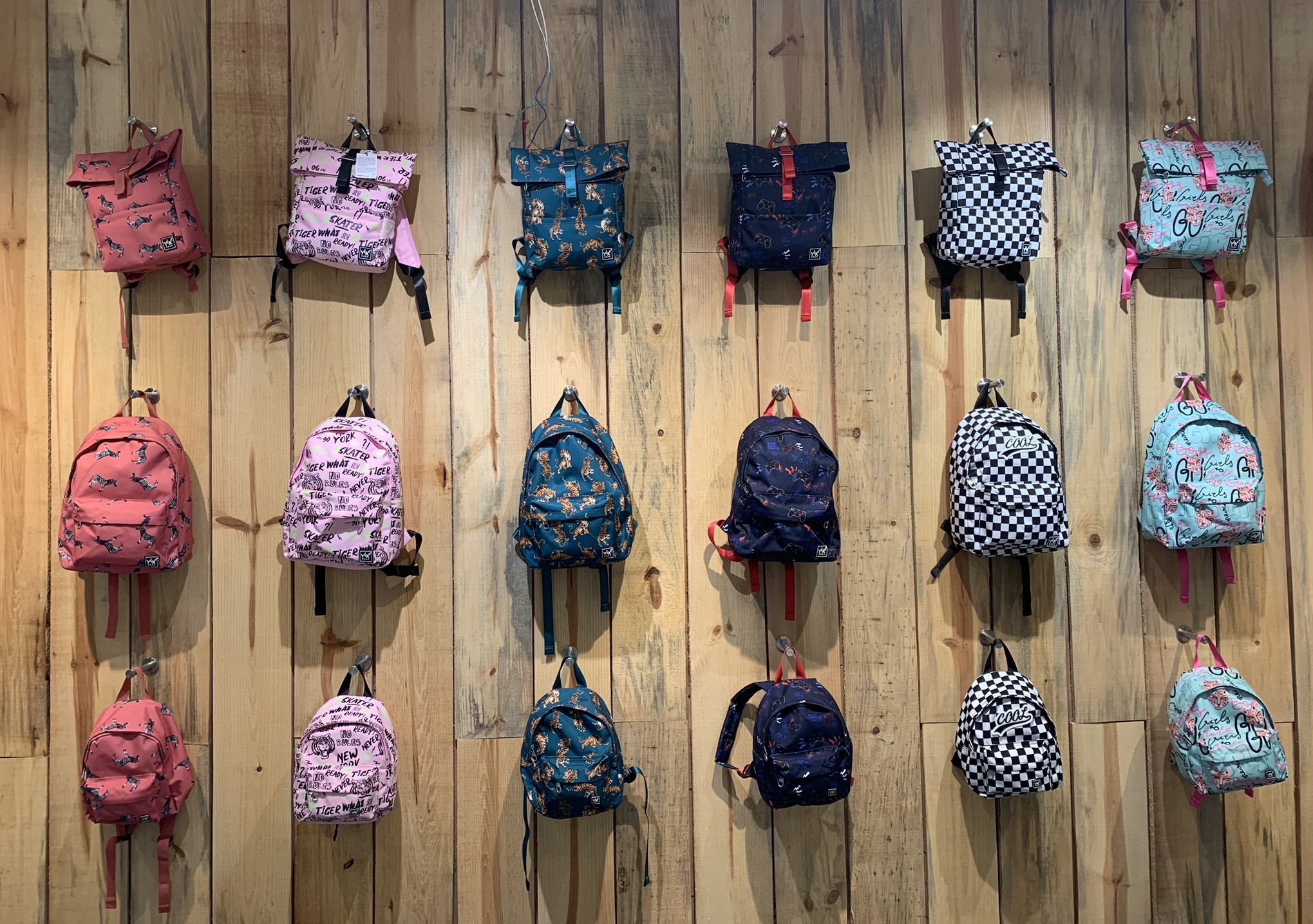 wall of hanging backpacks