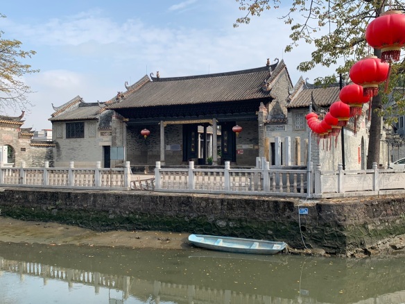 Chinese style building seen across a canal