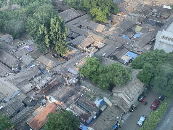 View of hutong neighborhood from above, showing very close buildings and narrow alleys