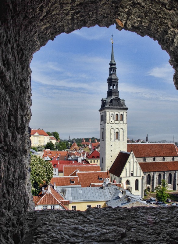 Rooftops and church spire seen from an old castle window